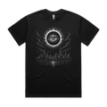 Front mockup of Vestigium XIII luxury 280 GSM heavyweight black t-shirt featuring a stark dystopian-gothic illustration of an ancient, watchful eye centred within a total solar eclipse corona looming over a silent city skyline and dark water printed in monochrome ink.