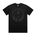 Front mockup of Vestigium XIII luxury 280 GSM heavyweight black t-shirt featuring a striking cosmic-dread illustration of a lone astronaut tethered in deep space, suspended directly above the massive silhouette of a colossal cephalopod rising from the darkness printed in monochrome ink.