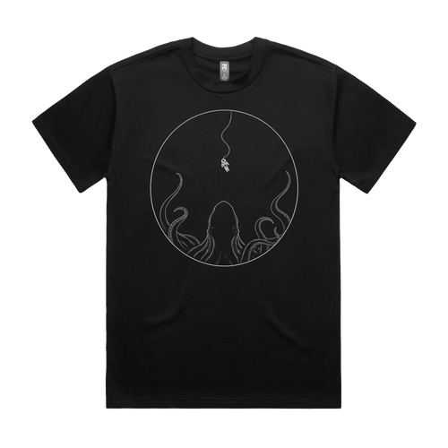 Front mockup of Vestigium XIII luxury 280 GSM heavyweight black t-shirt featuring a striking cosmic-dread illustration of a lone astronaut tethered in deep space, suspended directly above the massive silhouette of a colossal cephalopod rising from the darkness printed in monochrome ink.