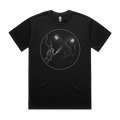 Front mockup of Vestigium XIII luxury 280 GSM heavyweight black t-shirt featuring a solitary deep-sea diver illuminated against an immense leviathan entity, rendered in meticulous stippled textures and razor-sharp fine-line detail printed in monochrome ink.