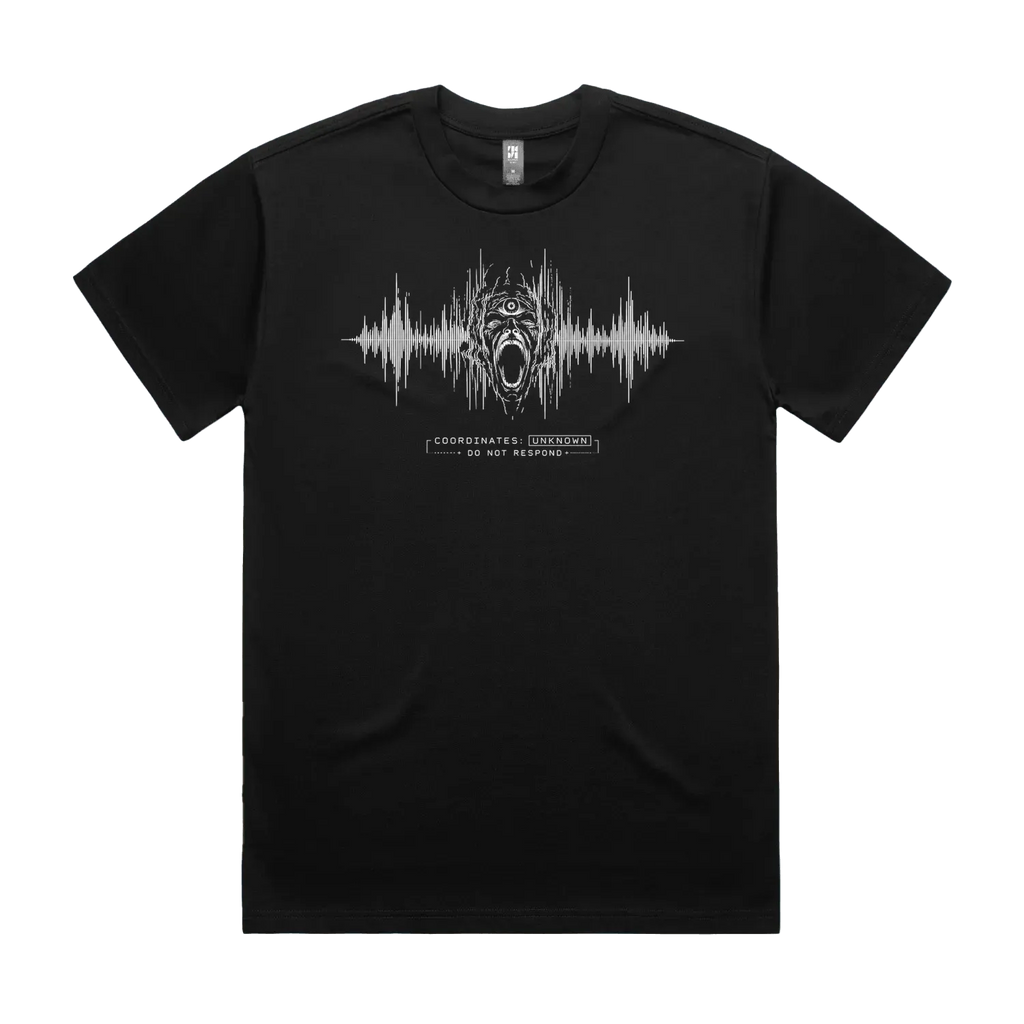 Front mockup of Vestigium XIII luxury 280 GSM heavyweight black t-shirt featuring a raw technical-noise illustration of a three-eyed agonized screaming entity emerging through distorted audio frequency telemetry lines and warning protocol markers printed in monochrome ink.