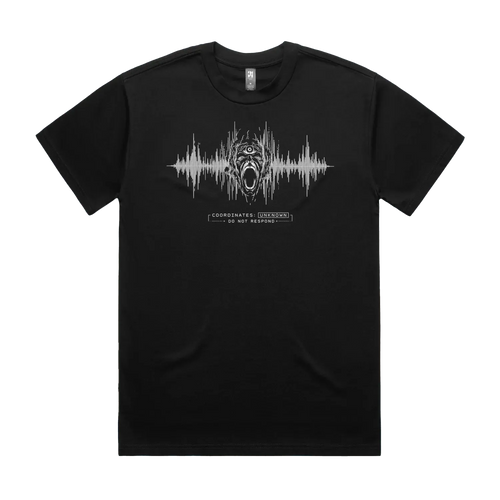 Front mockup of Vestigium XIII luxury 280 GSM heavyweight black t-shirt featuring a raw technical-noise illustration of a three-eyed agonized screaming entity emerging through distorted audio frequency telemetry lines and warning protocol markers printed in monochrome ink.